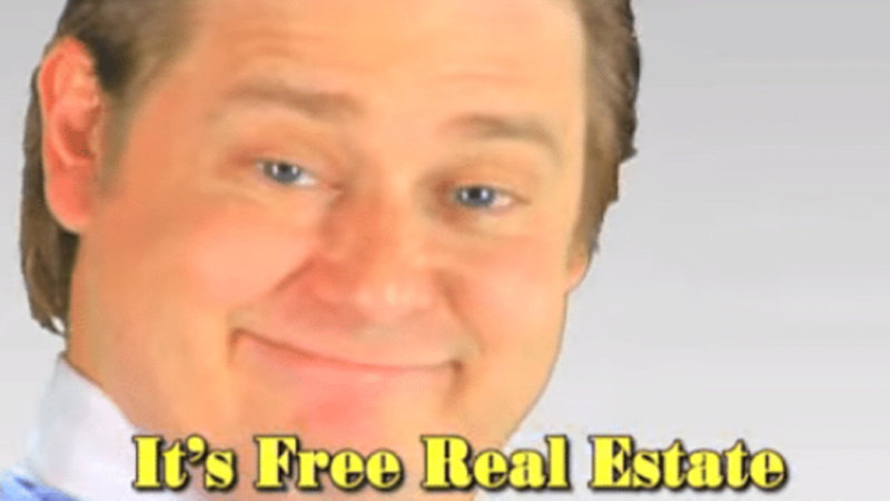 picture of a man smiling knowingly with the text 'free real estate' underneath